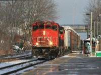 On Christmas Eve Day the sun briefly comes out as CN train L540 with GP38-2(W)’s 4777 and 4781 heads by the Kitchener station as they make their way to the Huron Park Spur and the interchange with Canadian Pacific.


