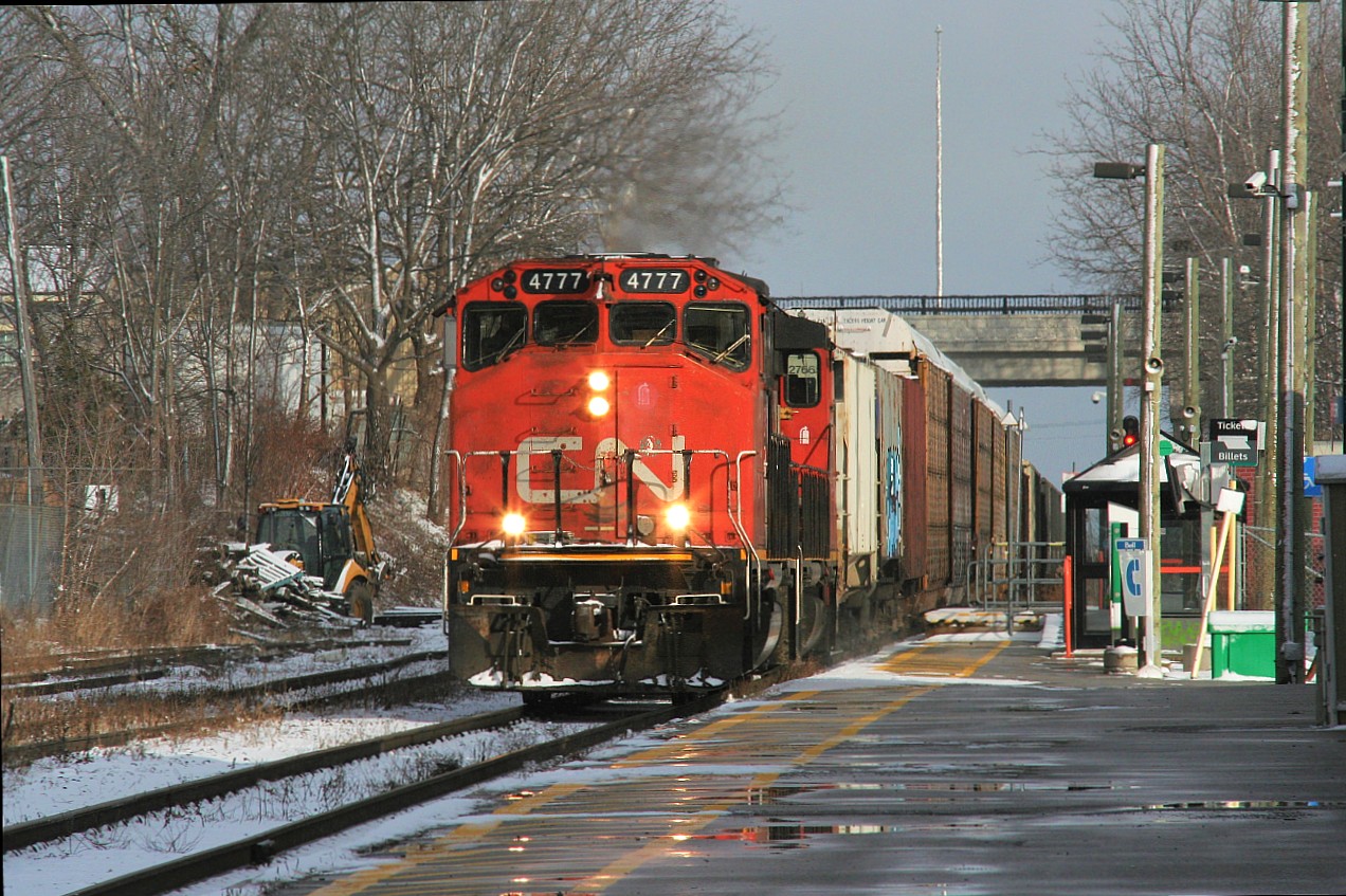 On Christmas Eve Day the sun briefly comes out as CN train L540 with GP38-2(W)’s 4777 and 4781 heads by the Kitchener station as they make their way to the Huron Park Spur and the interchange with Canadian Pacific.