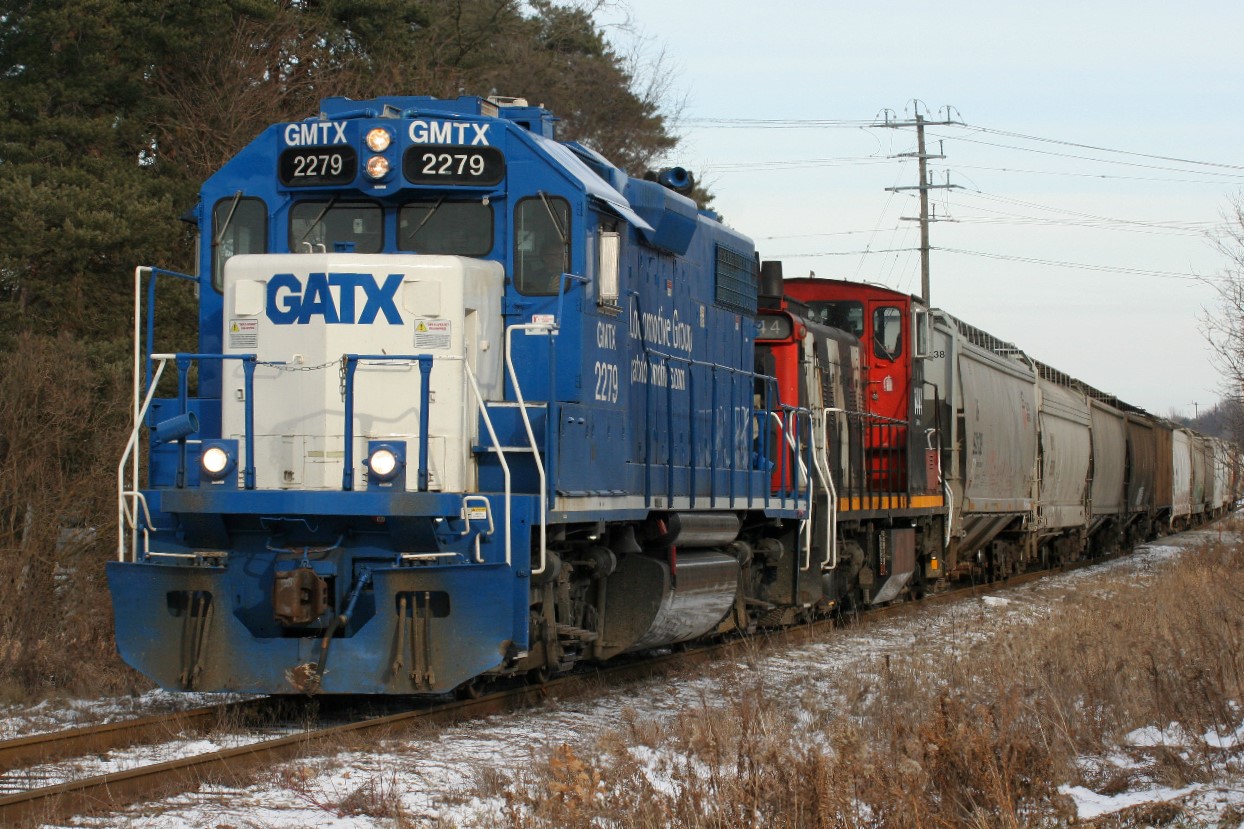 CN train L568 rolls through Baden the day after Boxing Day 2018 with GMTX 2279 and CN 1444. At the time, seeing 1444 trailing was a bit frustrating. However after almost a year later and eventually getting several chances to shoot other GMD1's operating in the lead on the Guelph Subdivision, time does seem to heal all.