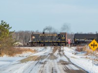 It was a productive morning in Niagara - 108 and 1859 were out for Trillium, <a href="http://www.railpictures.ca/?attachment_id=39733" target="_blank">CP TE11 was interchanging</a> with Trillium and CN, and <a href="http://www.railpictures.ca/?attachment_id=39708" target="_blank">Martech was switching their facility</a>. Here, 108 is pictured westbound on the Canal Spur (about halfway between WH Yard and Feeder), with a string of tanks for Feeder to be set off for interchange with CP and/or CN. They had come to WH Yard with a handful of tanks from the biodiesel plant, and tacked on maybe eight or so others in WH. After making the setoff at Feeder, they returned to the biodiesel plant where they worked for the day.