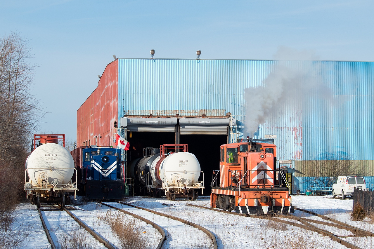 After setting off the tanks, ex-Stelco 615 puffs a bit of smoke as it pulls ahead at Martech's facility on the outskirts of Welland. Martech is doing some work for Procor, related to cleaning out hydrochloric acid cars such that the rubber lining can be inspected. The blue unit at left takes care of switching at Welded Tube, and interchanges with CN at Southern Yard. Catching this one running has so far eluded me.