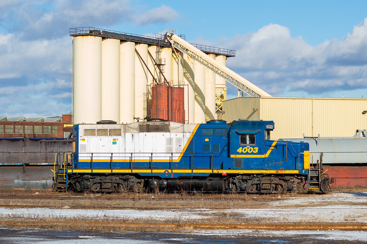 SOR's last day of operations in Hamilton was December 13, 2018, and a couple of us were out that day to document the final action at P&H and Parkdale Warehousing. Since then, 4003 has sat stored serviceable at G&W's Railcare facility in Hamilton. I hadn't really paid it much mind, other than glancing over every time I passed by to see if it had moved or had finally left the property. I figured though I should grab one shot of it at least, and the nice soft light a couple of weeks ago was hard to pass on. The silos in the background belong to Bell & MacKenzie which I believe is in the abrasives/sandblasting business in some capacity. They receive rail service, and if you seen CN or CP in the industrial area with two-bay hoppers, there's a very good chance those are going to or coming from Bell & MacKenzie. I don't think the track into that facility is in very good shape, as I once heard CP crews questioning each other as to whether they should even have the power past a certain point.