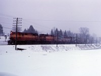 Over the winter of 1965-66, Canadian Pacific once again had many units on lease from railroads such as the Bessemer & Lake Erie, Boston & Maine, as well as the Lake Superior and Ishpeming. Here we see two of the LS&I's RSD12s (1804 and an unidentified unit) leading CP FPA2 4082 and RS10s 8593 east through Campbellville on a snowy day in early 1966.