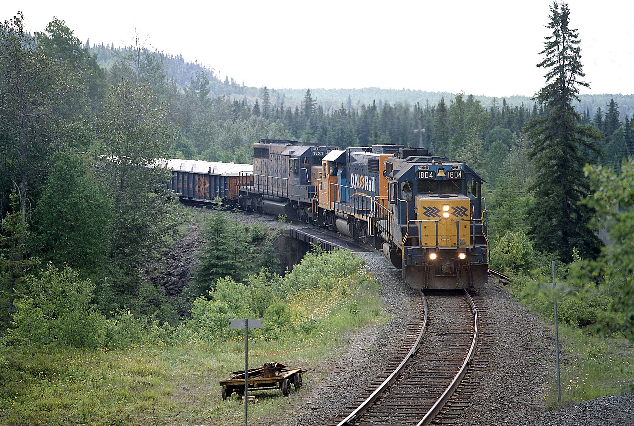 Up from Englehart and around thru Swastika Junction, the Rouyn-Noranda Turn with ONR 1804, 1800 and 1731 enters the Kirkland Lake sub running eastward. ONR 1731 is now gone from the roster, sold to Progress Rail in 2005.