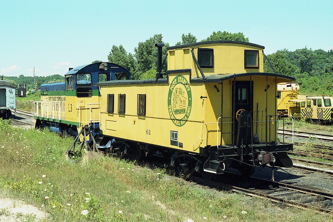 This is back in the early days of the Port Stanley tourist operation. Actually, this is the year they obtained their Provincial Charter in order to operate tourist passenger trains.
The former TH&B #61, obtained by PSTR in 1985, is now owned by the Southern Ontario Locomotive Restoration Society in St. Thomas. The switcher (x-Chessie) L3; is on the property of the OSR at Mount Elgin.