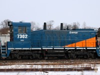Savage, Inc SW1200RSm 7302 hitches a ride through Brantford on CN 382 back in January of 2014

Built as CN 1368 in April of 1960, it would be rebuilt and numbered in 1987 to CN 7302. Before becoming CANX 7302, and then finally SVGX 7302