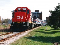 On May 5, 1995, CN had officially opened the new St. Clair River tunnel connecting Sarnia and Port Huron, Michigan. During the weekend of May 6-7 CN held many festivities in Sarnia and Port Huron to commemorate the event. CN had operated employee specials for workers across Southern Ontario as well as the US so they could attend the events along with their families. Both the American and Canadian passenger trains travelled down the Port Edward Spur in Sarnia to Centennial Park where the bulk of the festivities took place including live entertainment and displays. Here, the 20-car Blue Water Special with GT 6401, Amtrak 369 and Amtrak 297 are seen arriving near the Sarnia waterfront. This train hauled GT employees from Battle Creek, Lansing and Flint to the "Employee Day" events. 