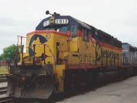 CSX train R320 with CSX GP38 2012 and CSX SD40-2 8060 with C&O caboose #904121 are paused by 
the iconic former CASO station in St. Thomas during the city's railway day’s event in August 1993. This train had just met CSX R321 with CSX C40-8W’s 7737 and 7694 with C&O caboose 904125, much to the delight of those attending the nearby railway day's festivities. 

 