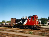 CN SW1200RS 1374 in it's newly applied CNNA colors switches Brantford yard on a quiet Sunday morning in 1993. I remember this well, as it was my first visit to Brantford to observe trains. My notes don't indicate it, however I remember 1374 later departing the yard and with cars followed by many many train horns, as it probably headed to Burford on what remained of the Burford Spur. I hadn't yet realized that line existed yet unfortunately as my dad and I were slowly just getting familiar with railfanning and the mainline was where our attention was. 

From my notes that day; CN 4129, 9565 and 9566 were also assigned to Brantford in the yard as well as cabooses 79770 and 79713. CN train 419 later came through with 5290/ 5109 and Windsor-bound 381 had 3510, EMD Leasing 772, which was ex-Conrail and 2101. 