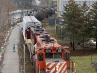 For one second it almost looks like old days on the old Goderich subdivision. I personally really miss the GP9U's on CP, but at least I still have a handful of hand-me-downs on the Ontario Southland. I spent a lot of time over the last 20 years chasing these old veteran Geeps around Ontario. The lighting on OSR's Guelph Junction Railway isn't the best for the morning northbound run, so overcast days work best for the most part. here a pair of OSR's former CP GP9U's roll along the Speed River in downtown Guelph on a bit of a dreary morning, but the sight and sounds of these old workhorses certainly brightened my day. 
