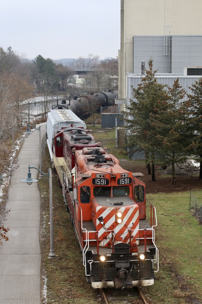 For one second it almost looks like old days on the old Goderich subdivision. I personally really miss the GP9U's on CP, but at least I still have a handful of hand-me-downs on the Ontario Southland. I spent a lot of time over the last 20 years chasing these old veteran Geeps around Ontario. The lighting on OSR's Guelph Junction Railway isn't the best for the morning northbound run, so overcast days work best for the most part. here a pair of OSR's former CP GP9U's roll along the Speed River in downtown Guelph on a bit of a dreary morning, but the sight and sounds of these old workhorses certainly brightened my day.