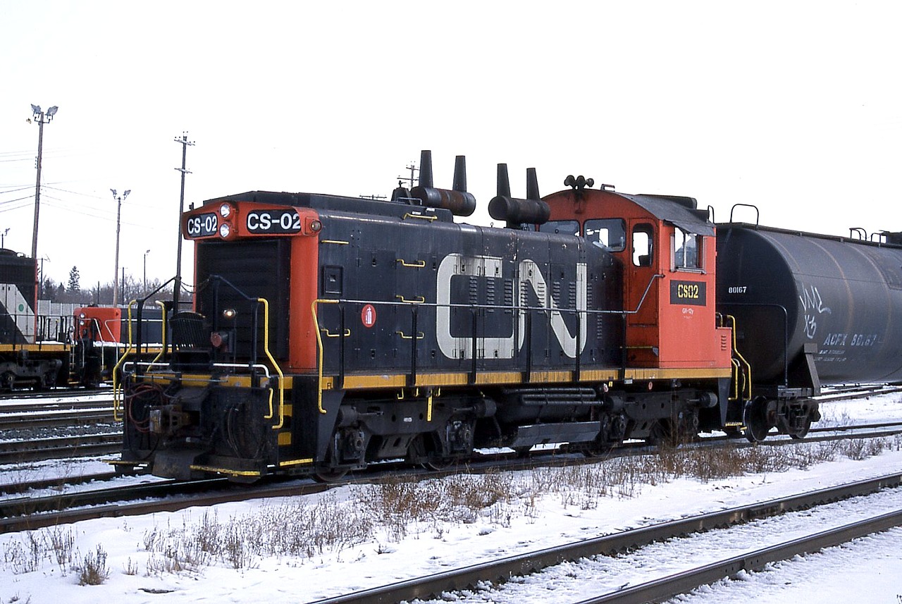 CN CS-02 switches a cut of cars outside of the car shop in Walker Yard.  I believe this was CN's attempt to reduce maintenance on a locomotive by classifying it as car shop equipment.  I don't think it lasted too long.  I had thought it was ex. CN 1272 but the Trackside Guide says 1272 was retired in 1995 and sold to Canac so I doubt CS-02 is that unit, unless it sat in storage and/or was CS-02 for years.