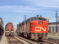 Merry Christmas.
With CN 4103 to the left and CN 6786 and CN 6788 to the right, this high-sun mid-June 1972 photo captures a Toronto Union Station scene no longer available.