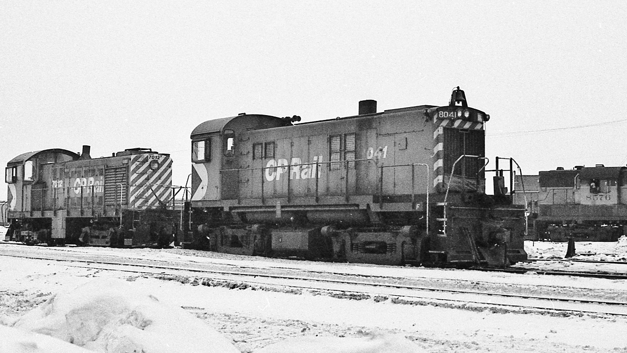 ...if you wait long enough...


...anything can show up at CP Agincourt....


 somehow  MLW RS23  #8041 ( 'ugly 80') strayed from the confines of  N.B. ( assigned to Saint John) and


  that ALCO, 1943 built, S2  is a 'senior' as of 1977 ( and those S2's  had the ' lumpiest '  idle imaginable) 


 At CP Rail Agincourt, February 1977 Kodak Tri X negative by S. Danko


 what 's interesting


 CPR 7012 predates  ' modern '  CPR steam power:  all the G5's /  some P2's /  the T1c's  ( MLW  built Pacific /  CLC & MLW built Mikado /  MLW built Selkirk )  


 8041 and sisters became Windsor and Hantsport power ( and other sisters daily OSR power)


 7012 retired by 1986


... from time to time a 7000 series would be assigned to  the  'Push' ,  to assist eastbounds up the hill from Leaside ( North Toronto Sub east end ) through Don Mills , Kennedy  ( Belleville Sub)  to Agincourt – the S2 pulling power was something to see & hear:  at  Leaside,  a  single  S2,   would  lift   two  4700's  and  their  train  while the 4700's crew put up their feet and watched the show ! 


   RS-10 8576     


   More Agincourt     


sdfourty