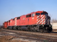 A pair of barns, CP 9003 and CP 9015, have just departed Alyth Yard and are now heading north out of Cowtown on the Red Deer Subdivision.