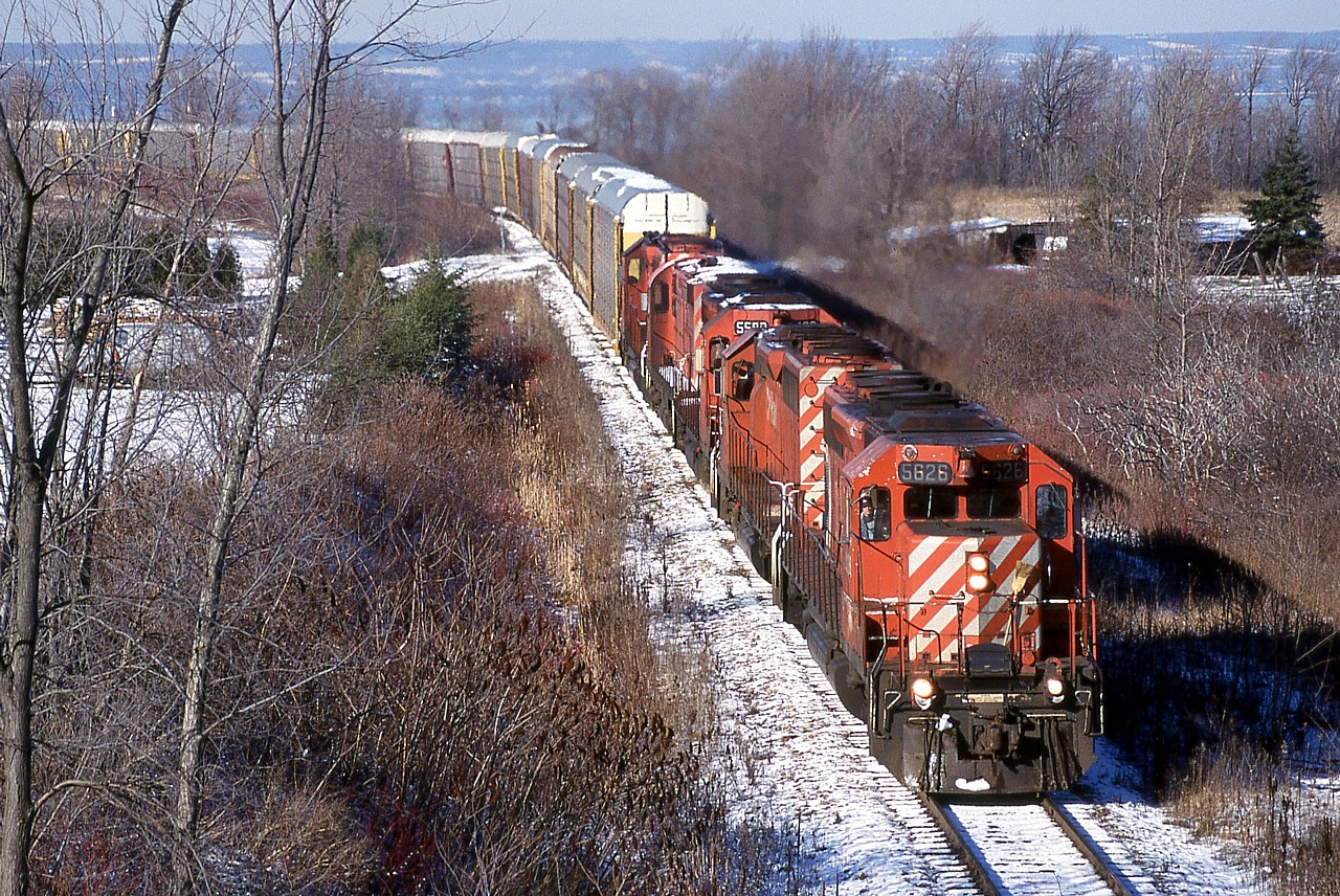 CP 5626, CP 5703, CP 5590, CP 1103 and CP 6043 lead a southbound train climbing the Niagara escarpment at Vinemount on a beautiful sunny but bitterly cold day.  Always a favourite photo of mine, and notable as it was the last day I saw Reg Button before he passed away.  I was in a hurry to get here for the shot so I didn't stop to talk to him at Kinnear but at least I got to wave goodbye.