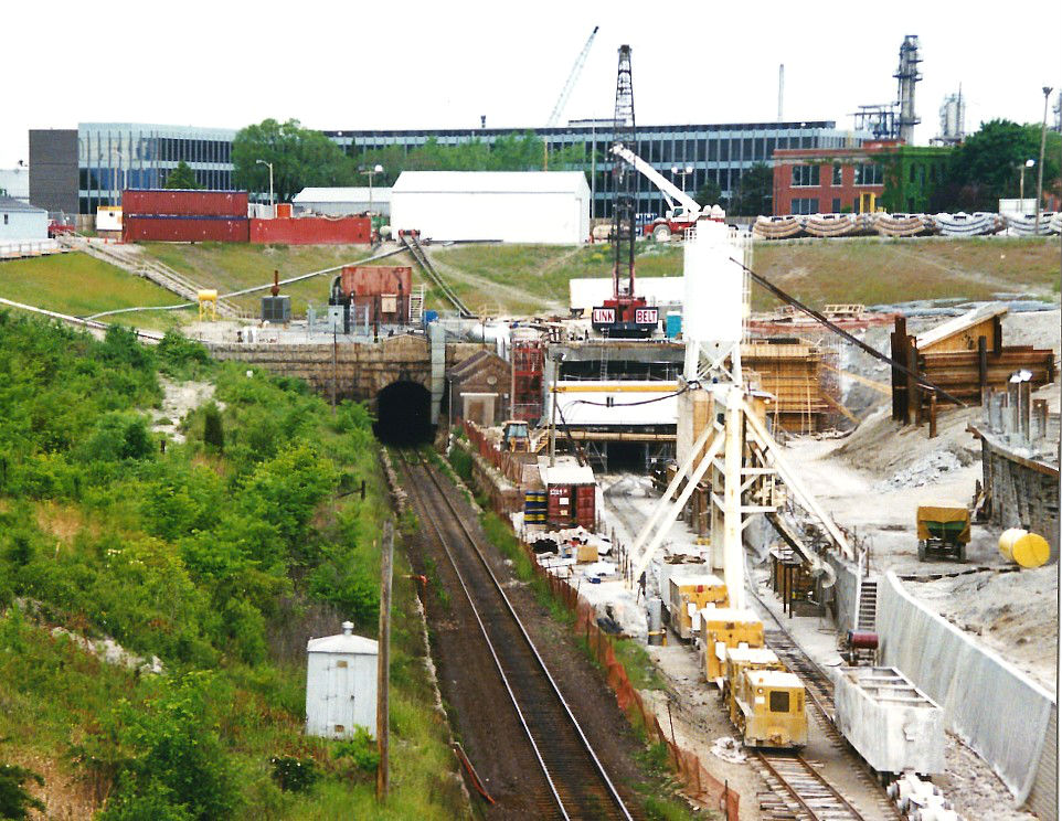 During the summer of 1994, the new CN St. Clair Tunnel is seen under construction, while the old tunnel to the left was still in use under the St. Clair River. The new tunnel officially opened a year later and was later renamed the Paul M. Tellier Tunnel in 2004 for the former CN president and chief executive officer.