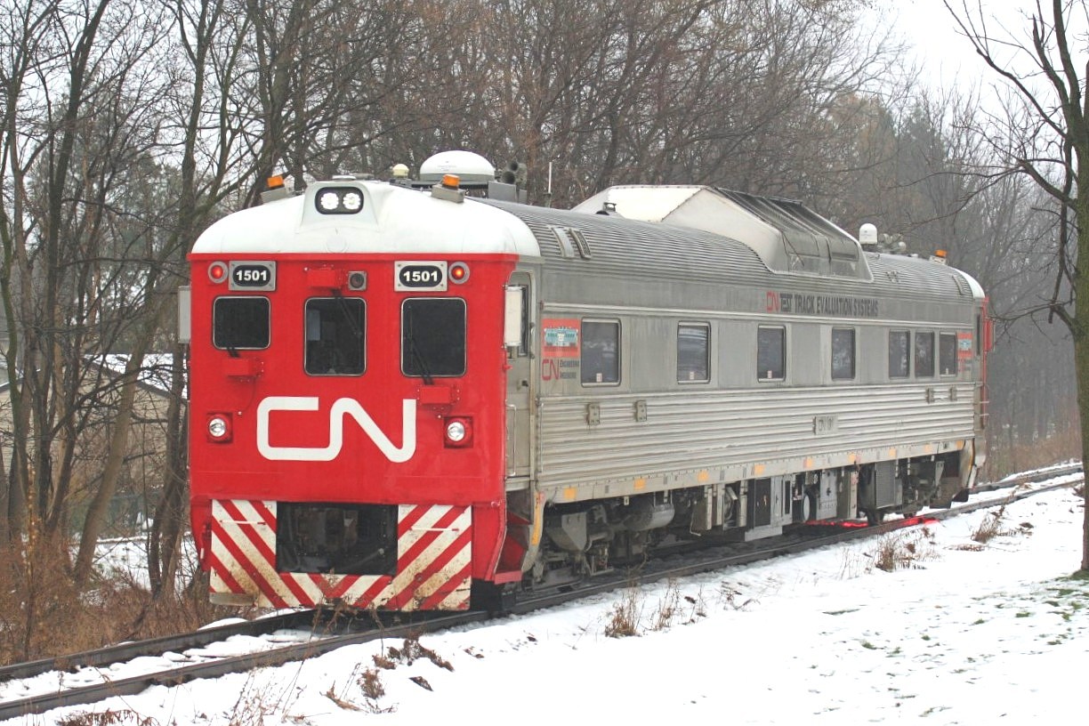 CN Track Evaluation RDC 1501 is slowly testing the Huron Park Spur at Queen Street in Kitchener on a foggy afternoon, after waiting for CN L540 to clear the spur. Later that afternoon, 1501 would proceed eastbound to Guelph, where it would tie-up for the night, with more testing to follow on the Guelph North and Fergus Spurs the following day.