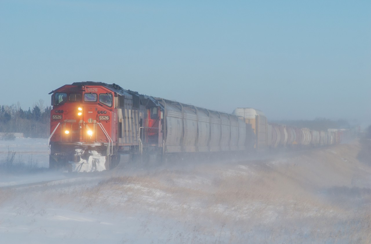 CN 5526 and 6022 lead 301 through some thick "ice fog" just outside Saskatoon.