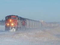 CN 5526 and 6022 lead 301 through some thick "ice fog" just outside Saskatoon. 
