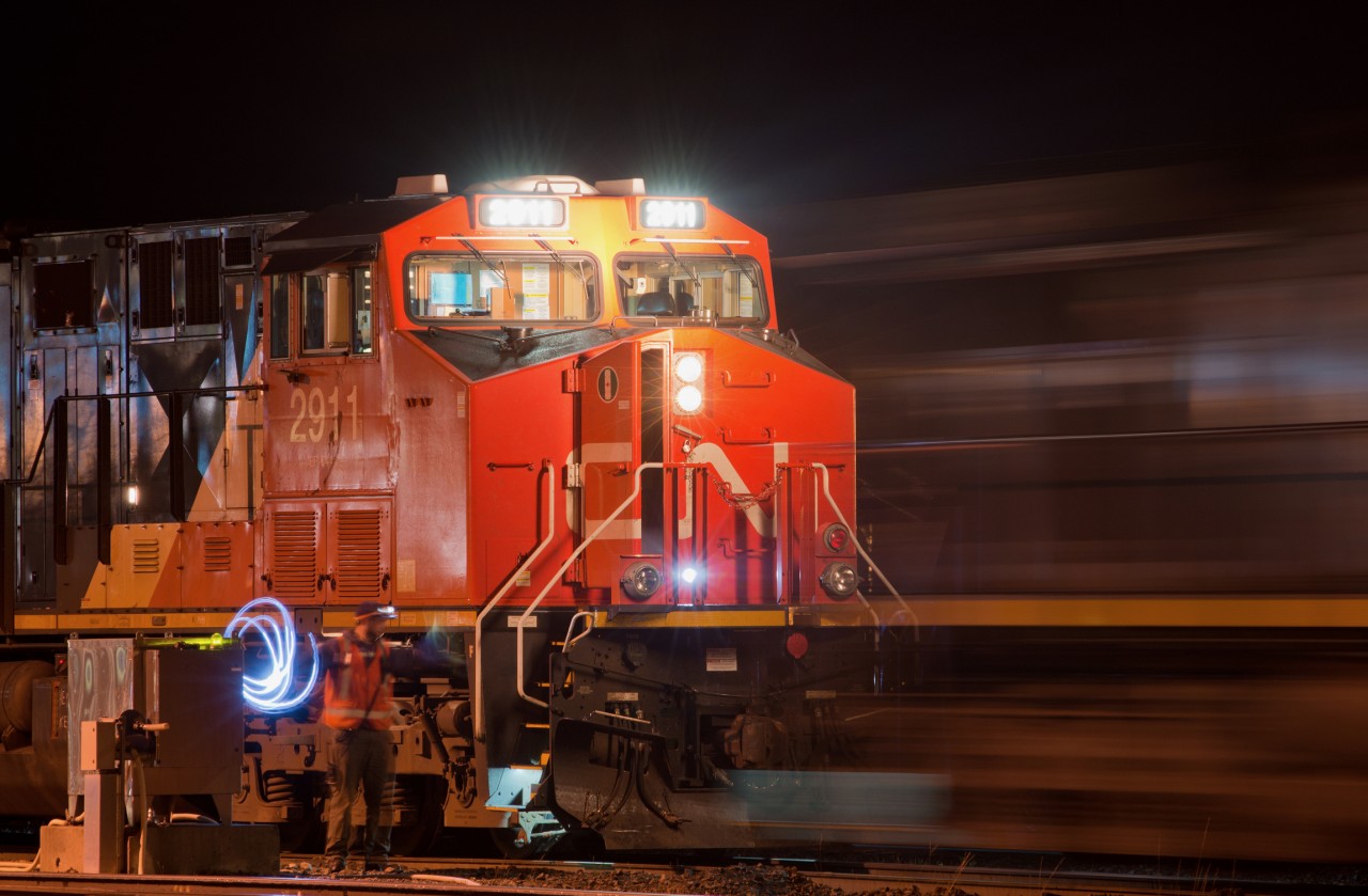 CN 2911 West is about to become CN 2657 West as the conductor uses hand signals to back the new lead unit on to the point at the west end of Jasper.