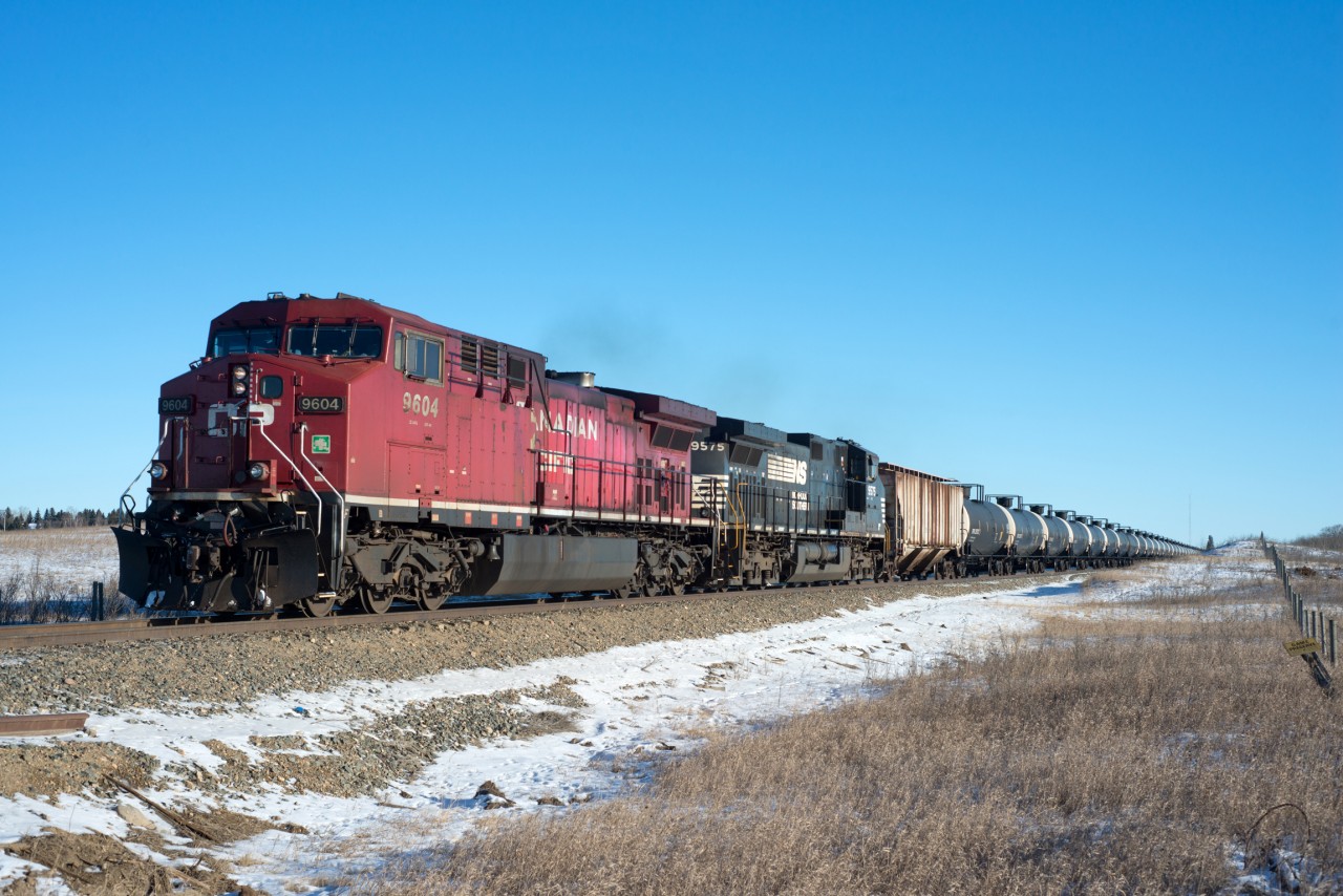 CP 9604 and NS 9575 head west through Macklin Saskatchewan with a set of crude oil empties for USD in Hardisty Alberta.