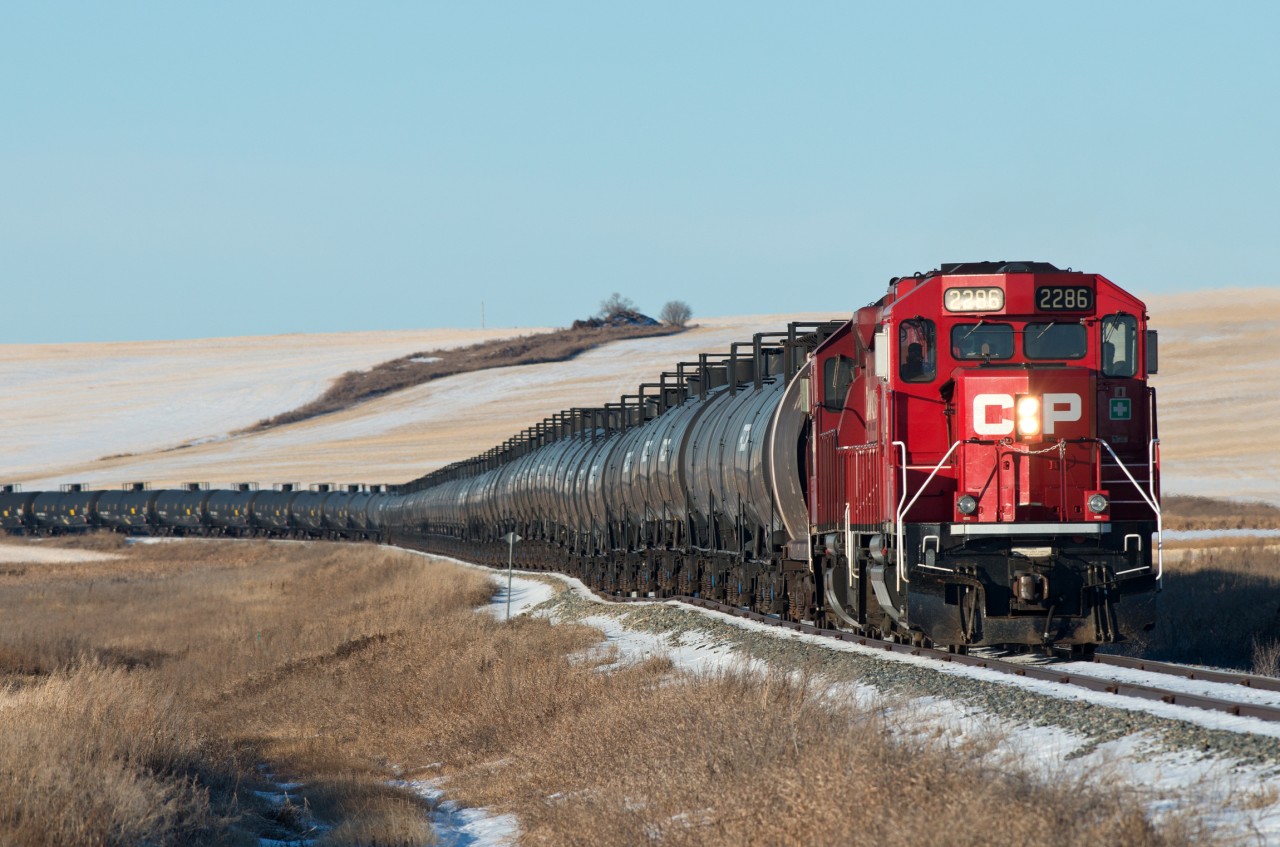 CP N61 is snowy making its way down the jointed rails of the Macklin Subdivision with 96 empties to be loaded with oil. Not a bad way to start 2020.