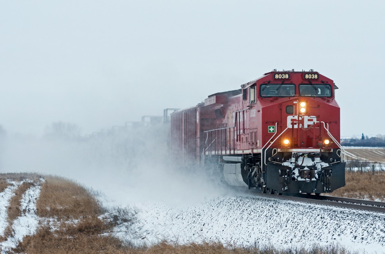 CP 8038 East kicks up some white stuff just east of Perdue Saskatchewan. Temperatures have been dipping into the -30's for the past week in the prairies, but the oil must keep moving.