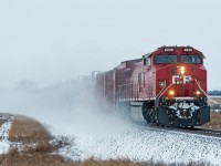 CP 8038 East kicks up some white stuff just east of Perdue Saskatchewan. Temperatures have been dipping into the -30's for the past week in the prairies, but the oil must keep moving. 