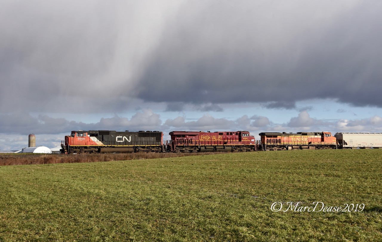 A rare appearance by one of Norfolk Southern's Heritage units in Southwestern Ontario. NS 8104 is the trailing unit on train 397 as it waits at Camlachie Sideroad waiting for clearance into Sarnia, ON., and over to Port Huron, MI.
