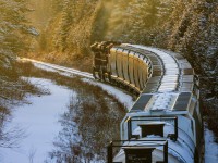 CN 8887 is in charge of train 406, as they climb the three mile grade approaching mile 75 of the Sussex Subdivision, heading into the golden sunset. 