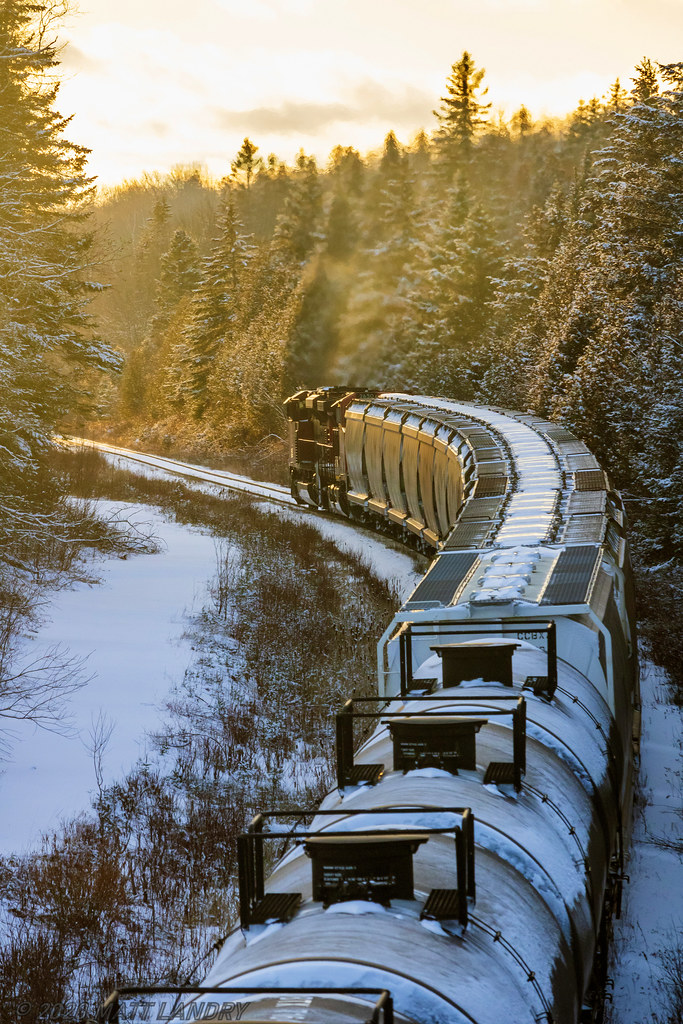 CN 8887 is in charge of train 406, as they climb the three mile grade approaching mile 75 of the Sussex Subdivision, heading into the golden sunset.