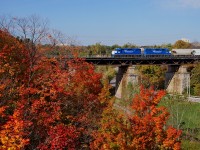 <b>A splash of colour</b> A pair of leased GMTX GP38-2's provide the power for CN 554 heading west out of Oakville.