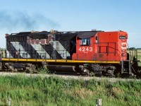 A roster shot of the 4342, taken west of Redwater at 19:45. Only a few years earlier (85 to 87) I was enjoying a wealth of variety in first generation units. In the last year preceding this photo, there was only a handful of occasions with a high hood GP9 in the consist, and only trailing, never leading. Essentially, B units with windows. It had been some several weeks since seeing the last one and on this sunny night, I took advantage. Good thing, as this is the last high hood I photo'd on the Coronado Sub. Showing some obvious signs of wear and tear but still pulling. The lineup consisted of the 4785, 4243, 4706 and 4704 hauling a hefty string of liquid sulphur tanks with an equal number of empty ballast hoppers. Cab 79487 brought up the rear. A period, not unlike the current GE's, started on the Coronado Sub. with most traffic headed up by GP38's (re-built GP9's made appearances). Although looking like a drab future, things were to change considerably in the next several years. Including having RailLink operating trains to the Fort McMurray area.