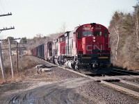 Down at Bayview CN #436 is waiting for traffic to clear off the Dundas sub before heading eastward toward Toronto.
Power is CN 2328, 2555 and 4414.  I was always a fan of the big M-636s, but never really did not see all that many of them leading.
The 2328 was retired by 1998 according to the trackside guide.
