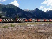 A CN eastbound freight rolls through Henry House (Mile 225.8 CN Edson Sub, east of Jasper) in Alberta powered by six units on the headend: CN SD40-2W 5351, SD40 5184, GP40-2W units 9564 & 9655, a GP38-2, and a 9100-series cabless F7Aum "B-unit" trailing.