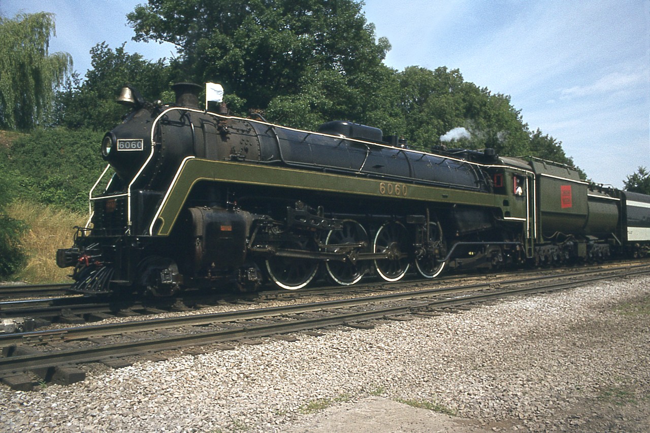 I remember this to be a really nice Saturday morning for the regular scheduled summer 'steam' trip from Toronto to Niagara Falls and return via Bullet Nosed Betty.
I grabbed a couple of shots and then a quick slide of it for posterity as it rolled by.
Nice that more than 40 years later I get to share it via Railpictures.ca.
NOT nice that it has gone west, thanks to the shortsightedness of our government. But what else is new?
