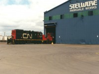 CN GP9RM 7031 and SW1200RSM 7305 are reaching deep into the Stelwire Parkdale Works in Hamilton's expansive industrial core as they service the facility. Being unfamiliar with the area at the time, it was hard to pin point the map to the exact location where the photograph was taken. Also, any information on how much this industrial trackage has changed since or even if it's still there today as well as any additional information would be welcome and appreciated.

