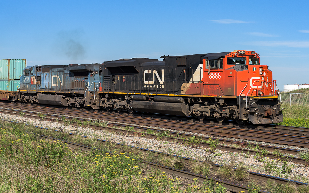 A couple of interesting units are heading up an eastbound IM. Nifty road number on the lead unit, the second is the exLMS (IC) unit 2459. The CN painted box behind the cab always puts a smile on my face, same with the noodle, it looks like it was hand painted. The summer of 2018 had a real variety of units going by every day. 2019 was much less so and I expect that this summer will be even less eventful with the arrival of so many new GE's. Photo taken at mile 259 at 10:00.