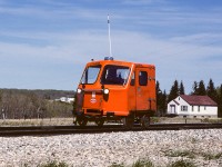 Just a few minutes prior to this photo, I was taking pictures of an Edmonton bound loaded sulphur train. As the caboose went by, in the distance you could see the section men were following close behind (it was after 12:30 and time for a dinner stop at Gibbons). Glad I waited for a photo as the fellows inside gave me a nice clear "rabbit ears" through the window. These new speeders were not many years old at this time. But, just like the yard cabs I made mention of in a previous caption, they did not last long. Trucks became the norm for traveling the rails. I have made a few trips myself in a speeder and comfortable they are not. I'm sure most enjoyed the move to truck cabs, certainly more comfy, quiet and warm. Photo taken just east of the highway overpass at Gibbons.