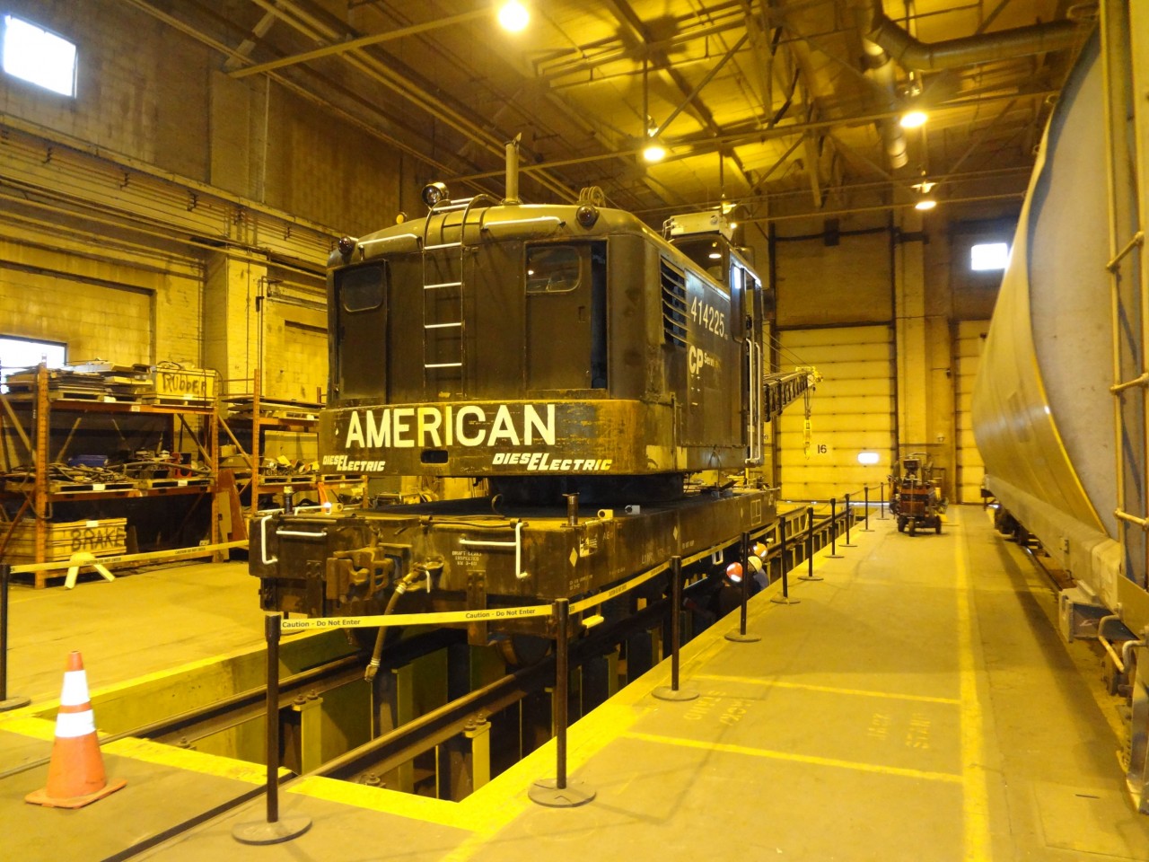 Just inside door 16 and over the pit in Building H at CP's Weston shop is CP 414225, an American Hoist & Derrick model 830 DE locomotive crane, serial number L-3663, built new for CP in June of 1965. The crane is in for some operator maintenance training and and a complete under car body inspection including gear cases, traction transmissions, and traction motors. In the shop on the same track behind the crane are snow plow CP 401034 and Jordan spreader CP 402877. It's a busy time in the shop readying all this work equipment for winter.