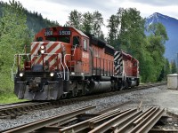 A pair of SD40-2's, led by CP 5908, are seen heading west out of the siding at Taft.