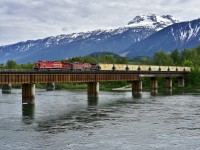 CP nos.8033 & 9705 bring an eastbound empty potash onto the rail bridge at Revelstoke.