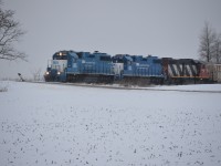 [Editors note: our youngest contributor and first submission] CN L568 crawls as it approaches a slow order across the bridge over Line 34 (Highway 7/8) Just outside of New Hamburg on their way back from Stratford. The power consisted of GP38-2 GMTX 2254, GP38-2 GMTX 2284 and GP38-2 CN 4713 pulling a decent sized train to Kitchener. 