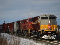 CP 7018 South has just cut away from their tail end setoff at Spence and is pulling down to the 10th line while the Conductor gets a ride around to the head end. Looking fresh and really sharp, 7018 is one of 10 maroon and grey heritage units (7010-7014 in script, 7015-7019 in block lettering), just being delivered to CP along with 7019 to complete the series on Dec 27th. 