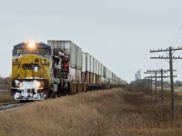 A detouring train 114 is seen on the former CNoR secondary main line at Warman SK. In less than a mile the train will swing on to the Warman Sub and head down to Saskatoon to re-join the main. 