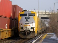 A late CN 120 is heading towards Taschereau Yard at left as VIA 635 arrives at Dorval Station with VIA 907 leading. 