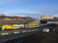 VIA 633 is heading towards its next stop at Dorval with VIA 913 leading and business class car VIA 3476 as the first car. This is the the only VIA business class car to be wrapped and currently features 'L'avenir est à bord' on this side and 'love the way' on the other side.