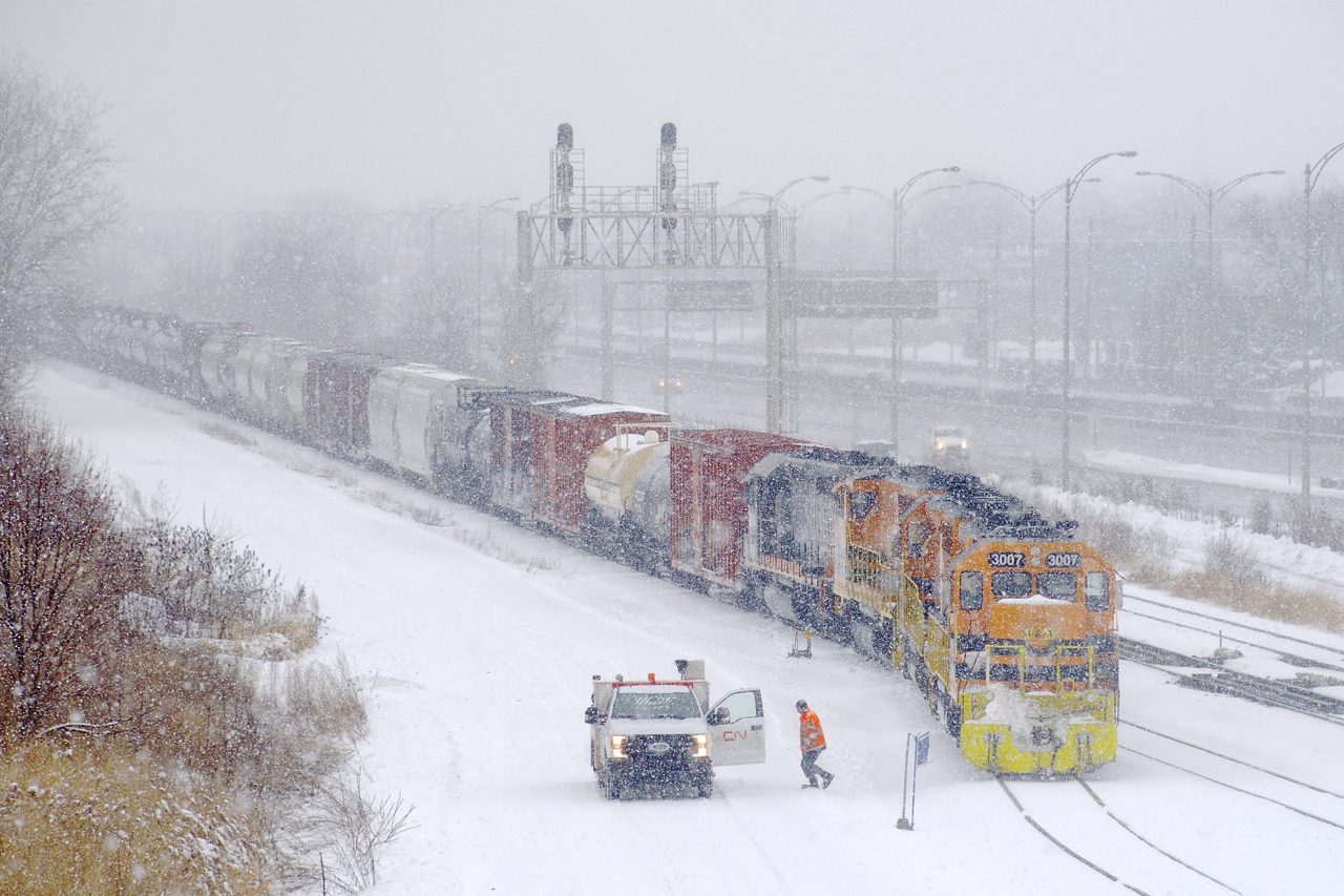 After being held out of Southwark Yard for a short period, the conductor has thrown the switch and SLR 393 is slowly pulling into the yard with SLR 3007, SLR 3008, QGRY 3014, QGRY 6904 for power and 42 cars. Six days a week the St. Lawrence & Atlantic sends a train from Richmond to Southwark Yard and return, using its own tracks as well as trackage rights on CN's St-Hyacinthe Sub.