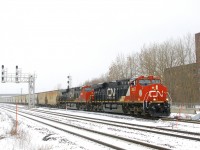 After not running for quite a number of months, the second CN B730 to run in about a week heads east after changing crews at Turcot Ouest on an icey morning as the engineer offers a friendly wave. This train has 203 potash loads for Saint John, New Brunswick and is powered by four GE products, with CN 3857 & CN 2885 up front, CN 2982 mid-train and CN 3866 on the tail end.